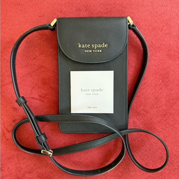 kate spade Handbags - Kate Spade ns flap phone cross body purse. NWOT, black. Adjustable strap.